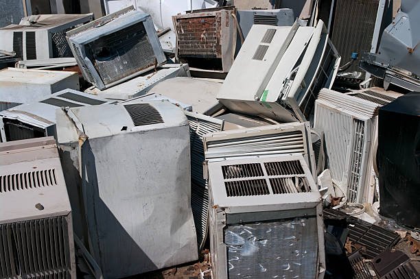 Dumped AC units in a scrapyard